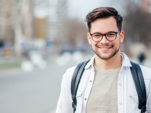 Young-man-in-white-shirt-and-glasses